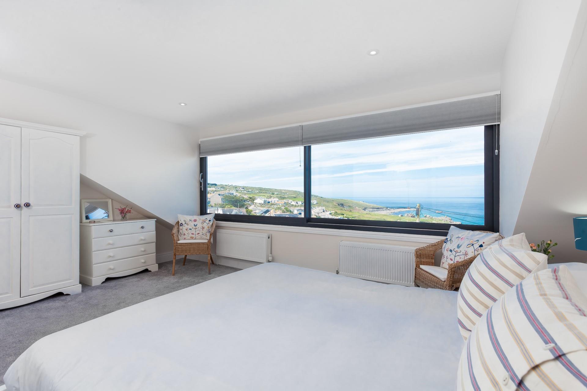 Tuck into bed and watch the sunset over the sea after a memorable day in Cornwall.