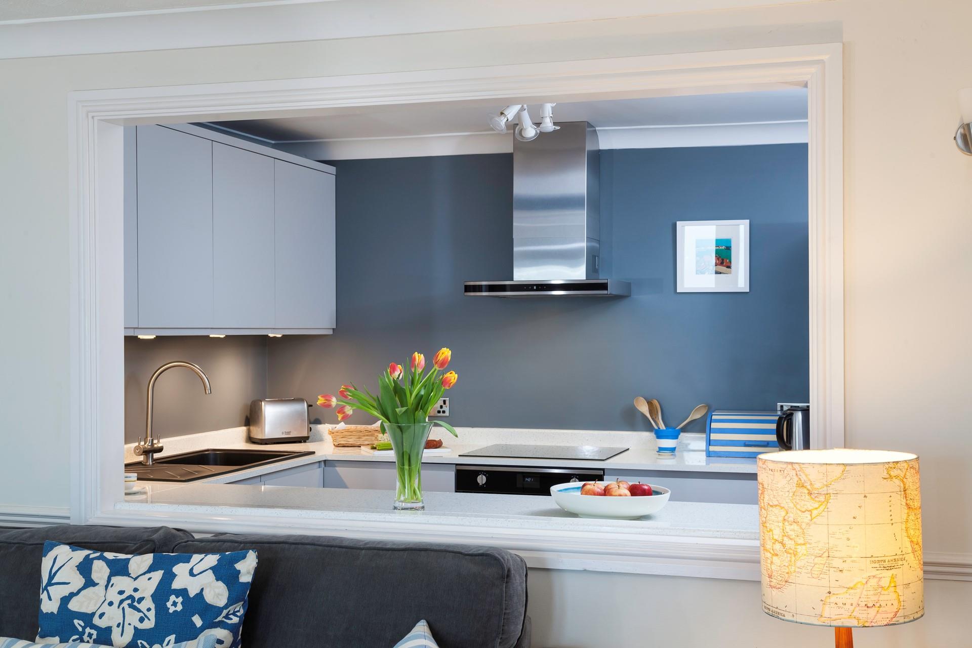 The serving hatch is perfect for entertaining guests while preparing a hearty meal.