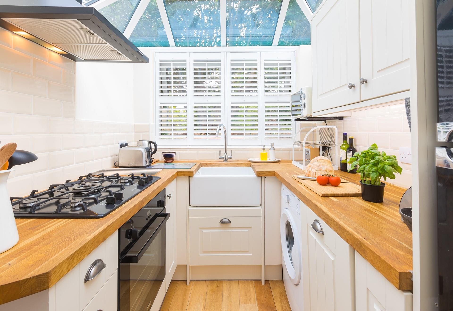 The modern well-equipped kitchen is a delightful space to cook up a storm.