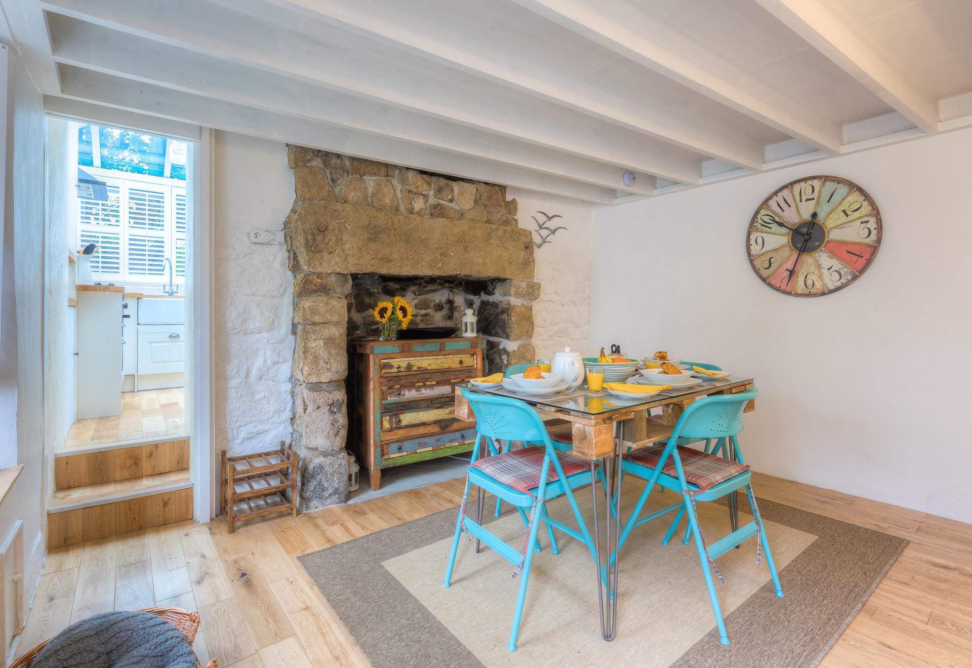 The dining area welcomes you as you initially come through the front door, which then leads off to the kitchen and sitting room.