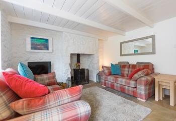 Enjoy a family movie night with the woodburner lit in the cosy sitting room.