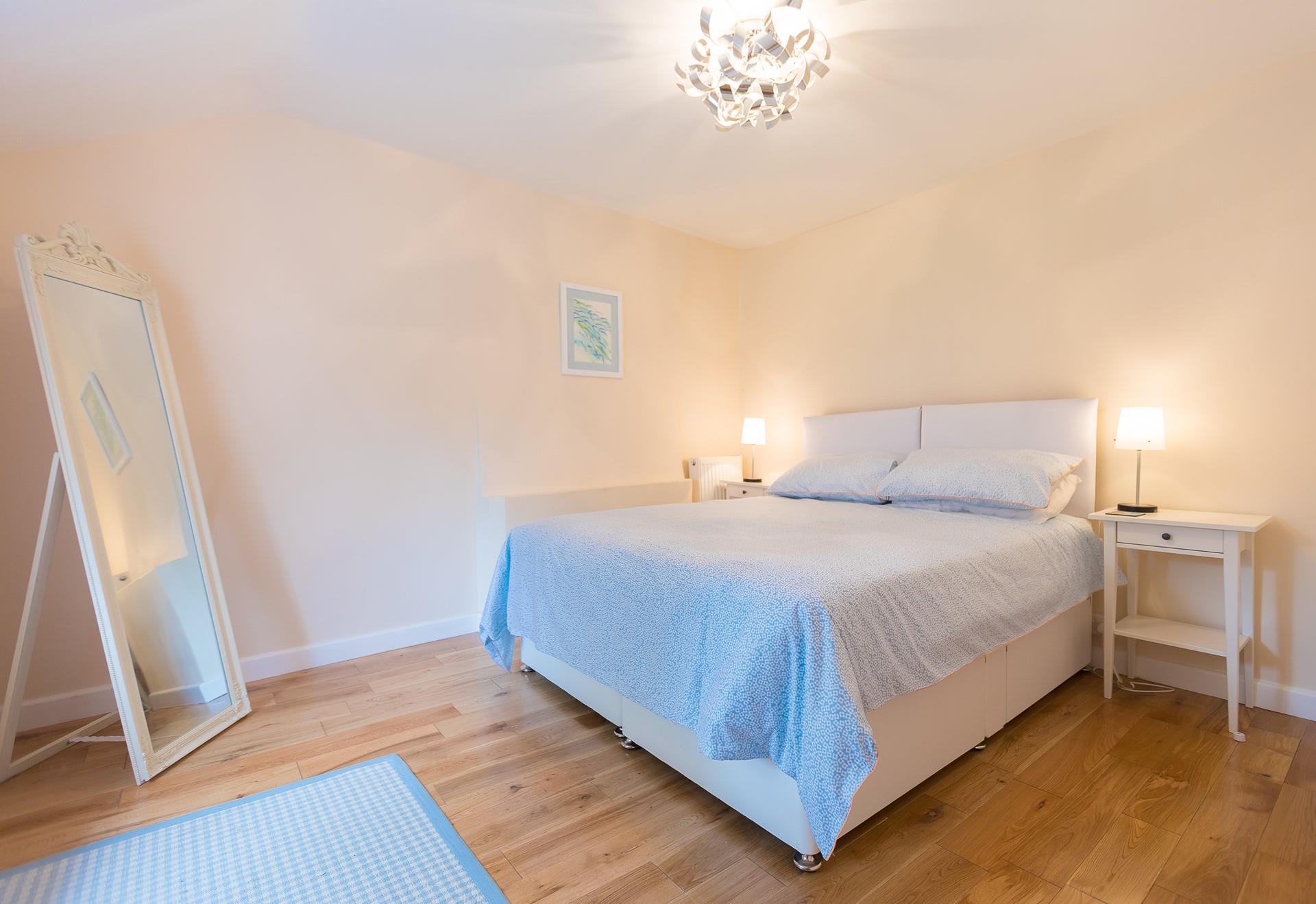 Climb into the spacious king size bed and drift off for a peaceful night's sleep.