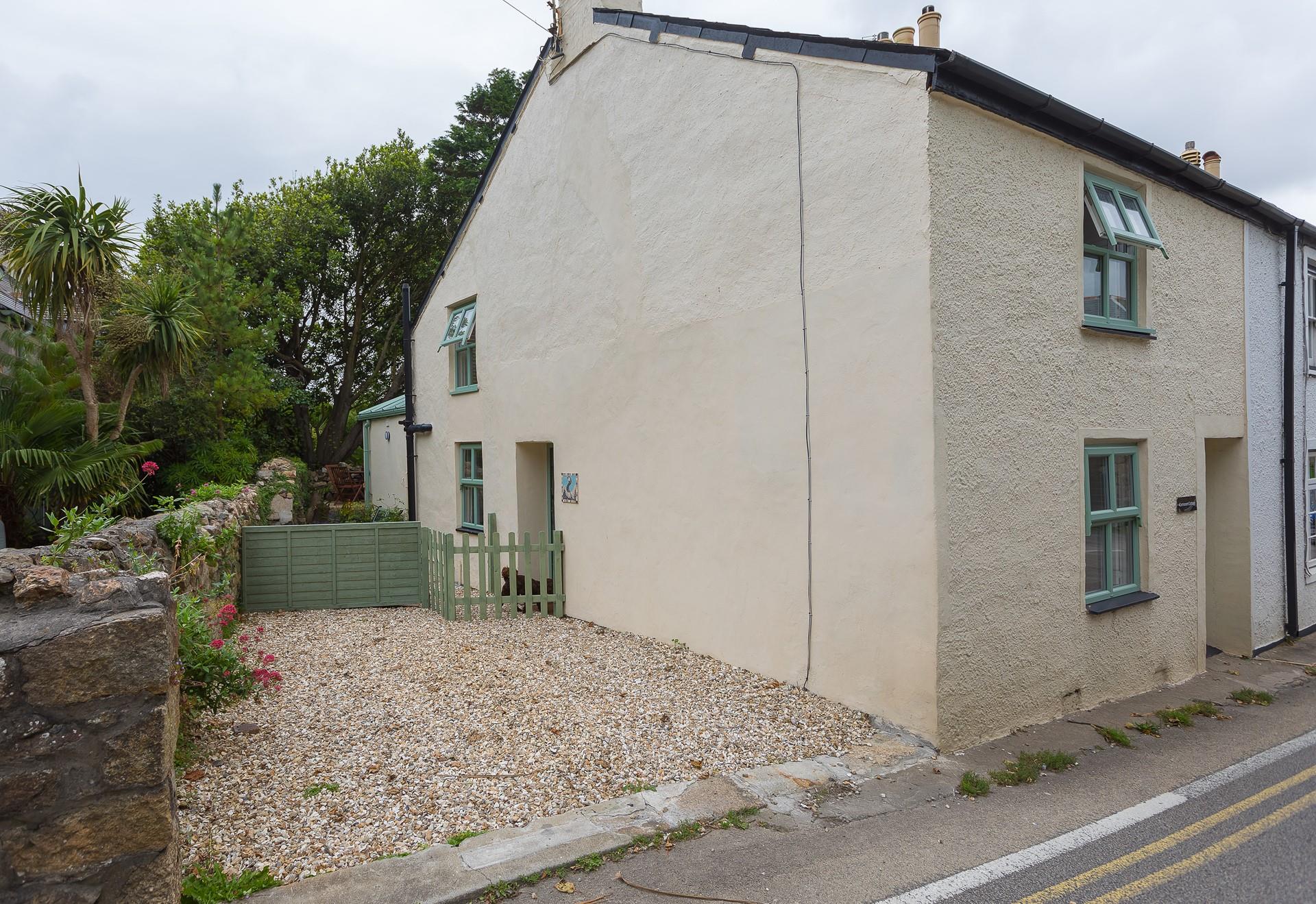 A view of the cottage and all-important parking space.