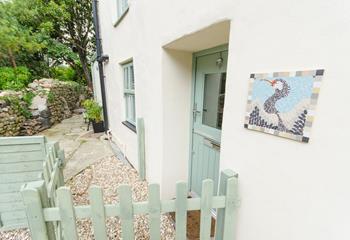 A quaint and welcoming arrival awaits at Cormorant cottage.
