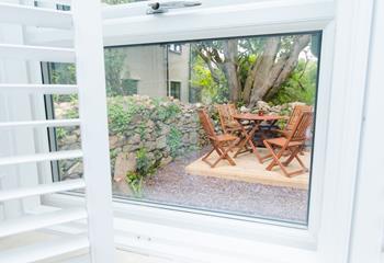 The kitchen window overlooks the quaint courtyard garden.