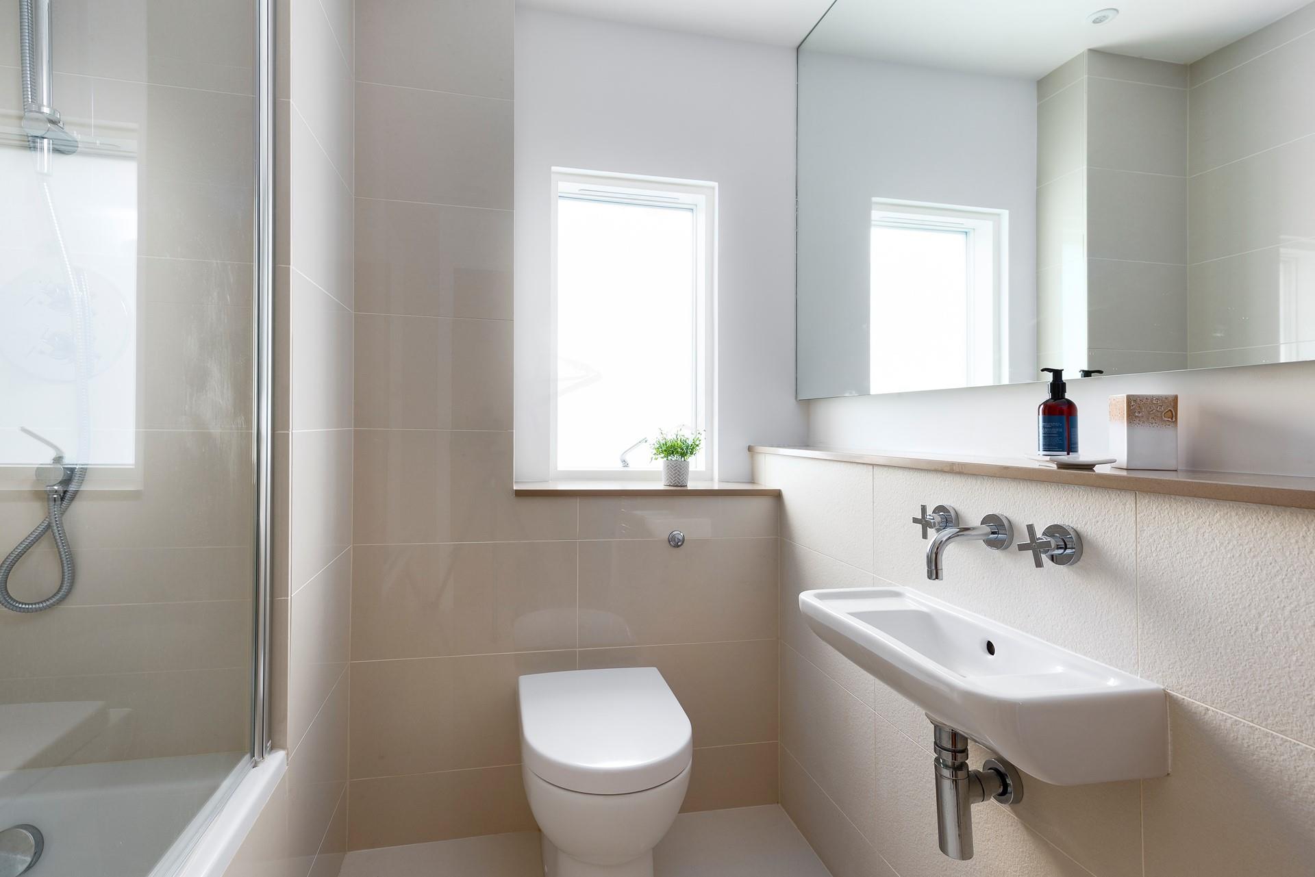 Neutral tones ensure the bathrooms offer a relaxing experience. 