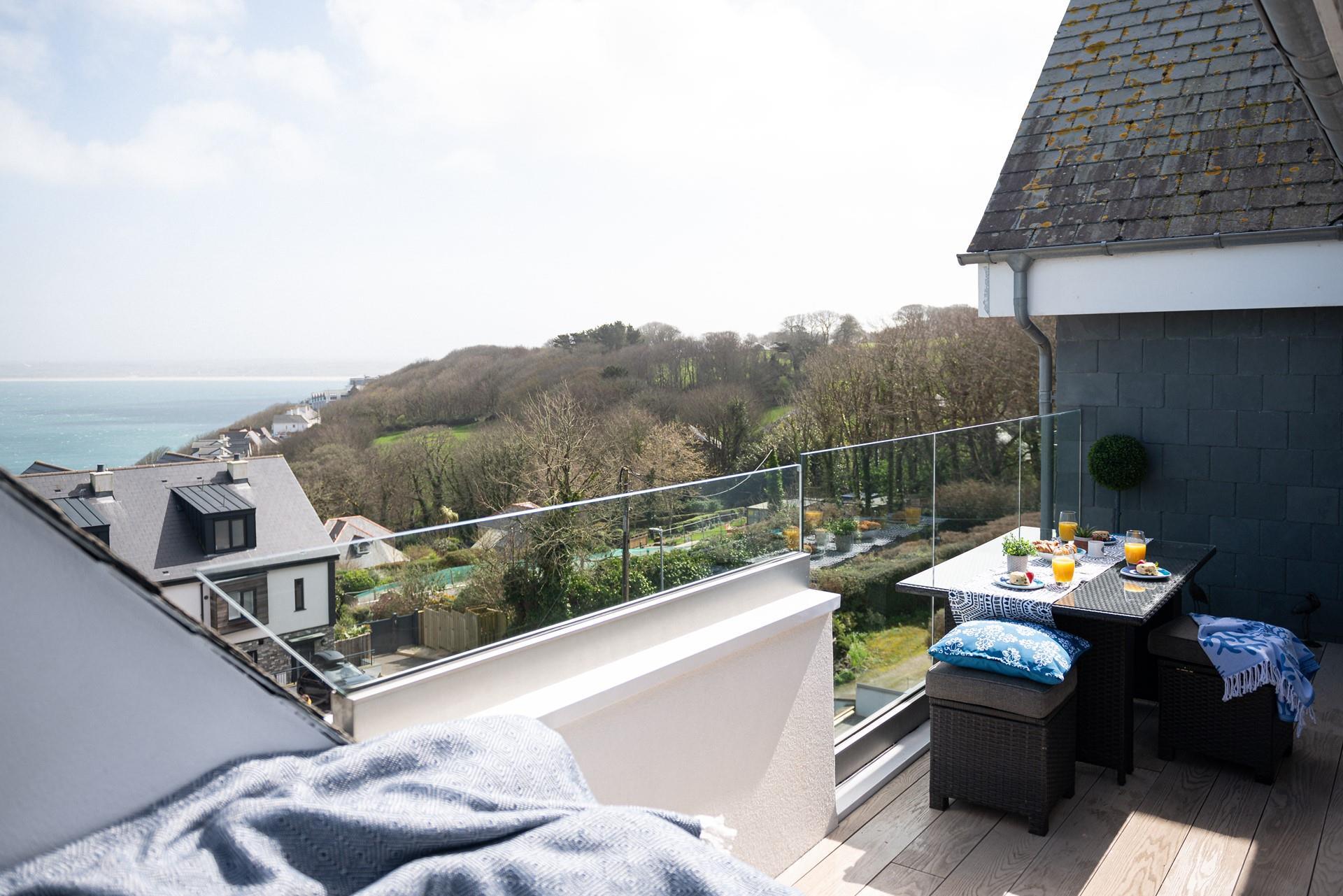 Sunbathe on the balcony enjoying the seaside sights and sounds.