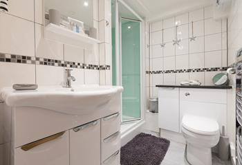 Though compact the bathroom has been designed to make the most of the space and is beautifully decorated. 