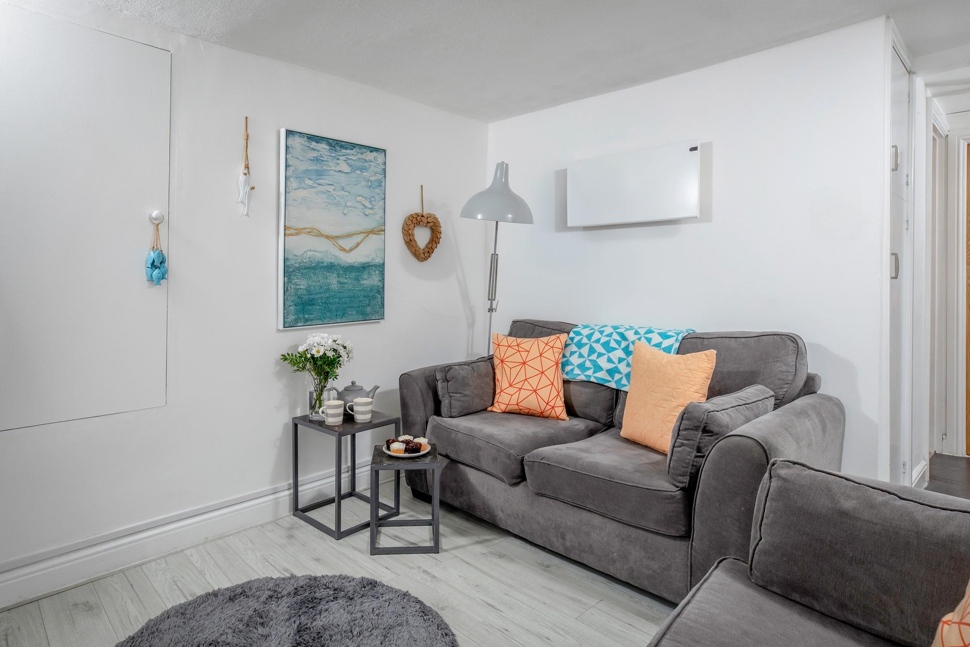 Seaside artwork adorns the living room.