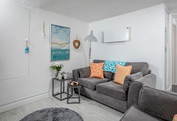 Seaside artwork adorns the living room.