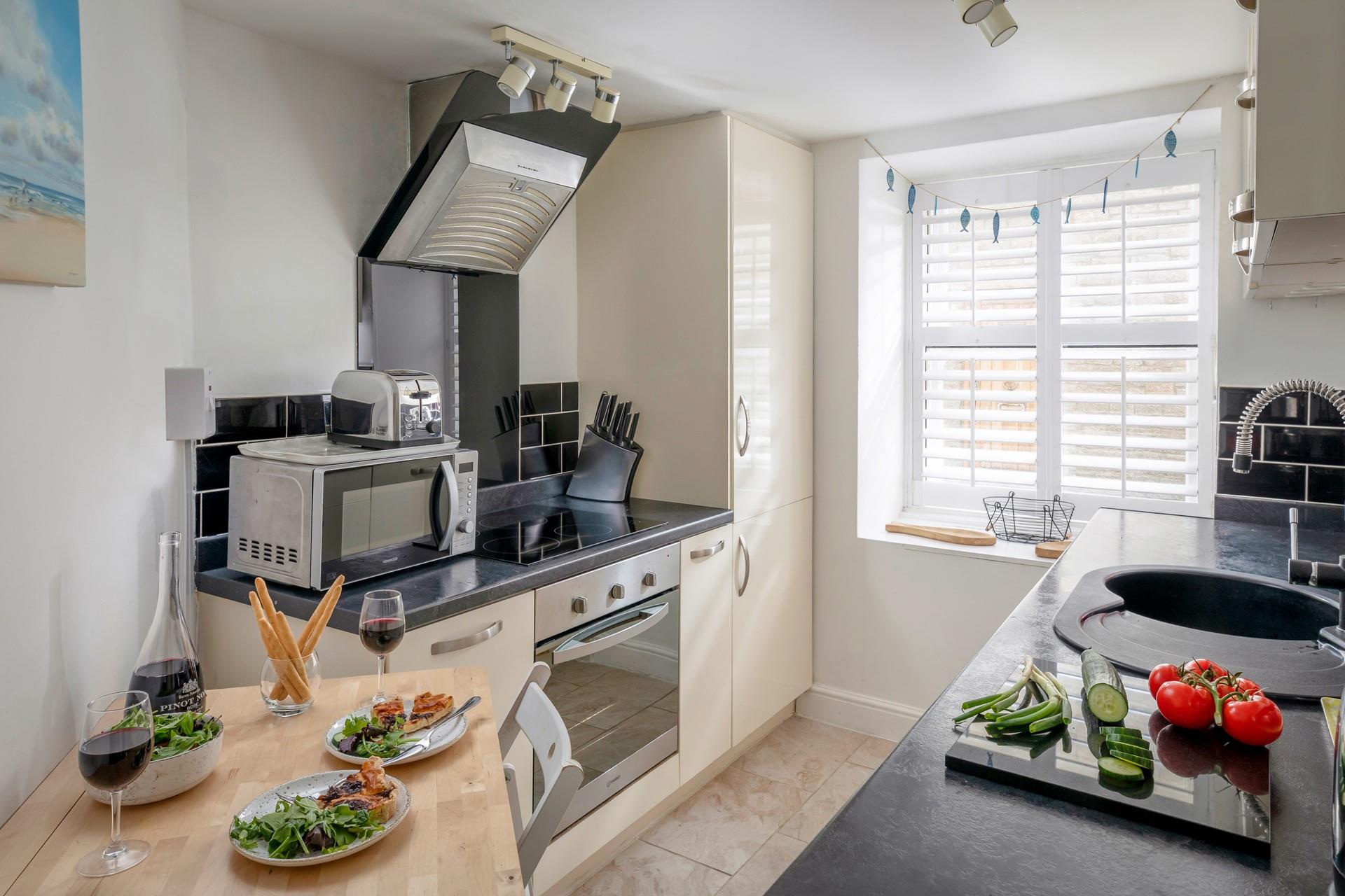 The dining table and chairs cleverly fold away against the wall to maximize space.