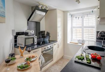 The dining table and chairs cleverly fold away against the wall to maximize space.