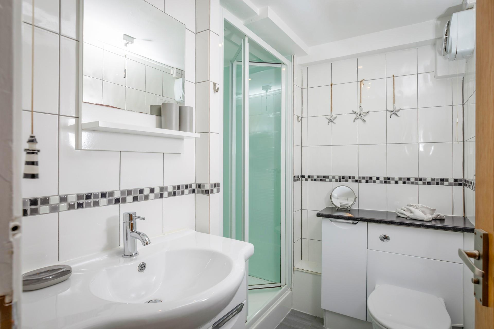 The bathroom has all you need after a day on the beach!