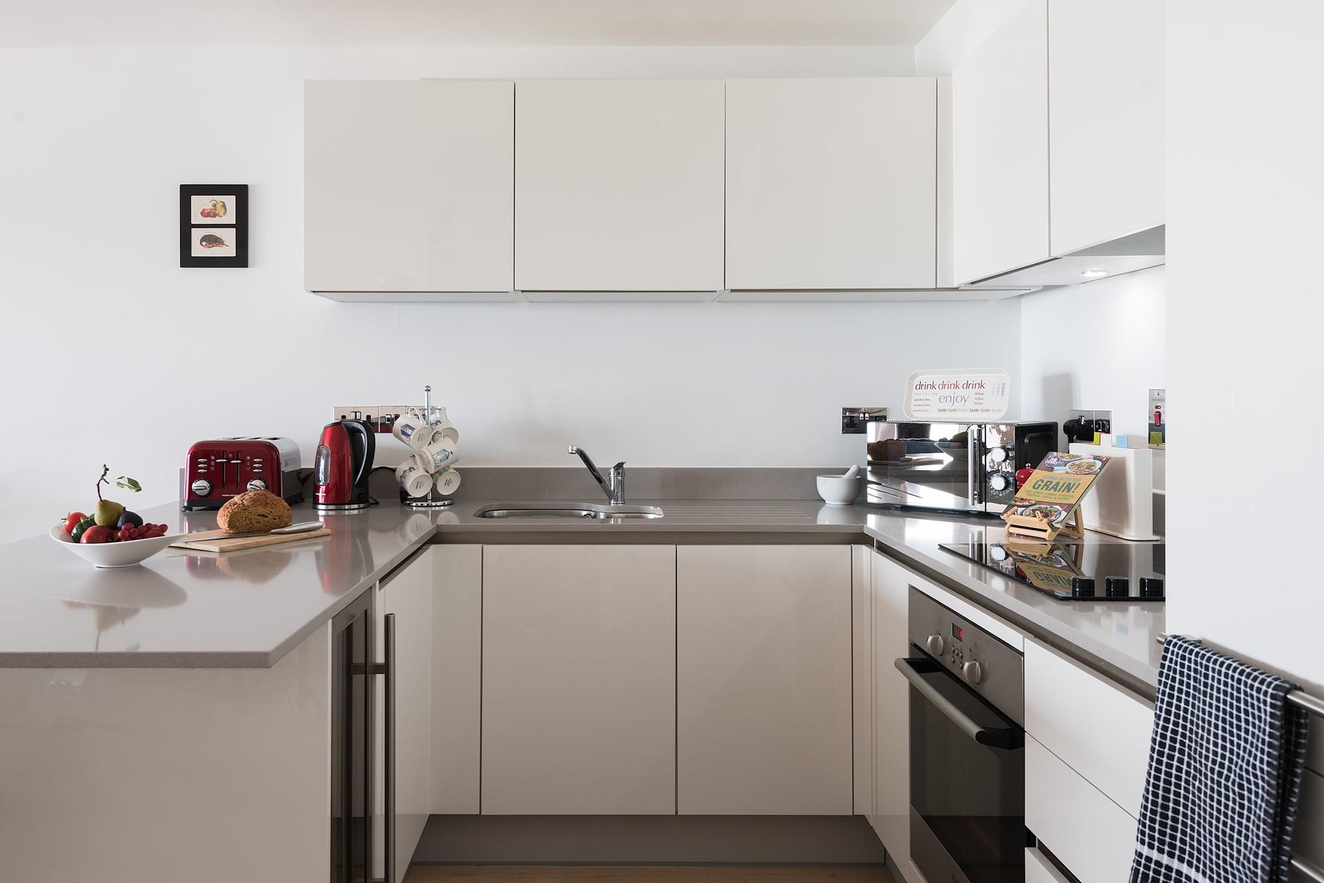 A modern kitchen with integrated appliances provides all you need for cooking up a feast. 