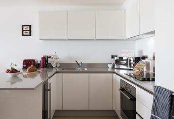 A modern kitchen with integrated appliances provides all you need for cooking up a feast. 
