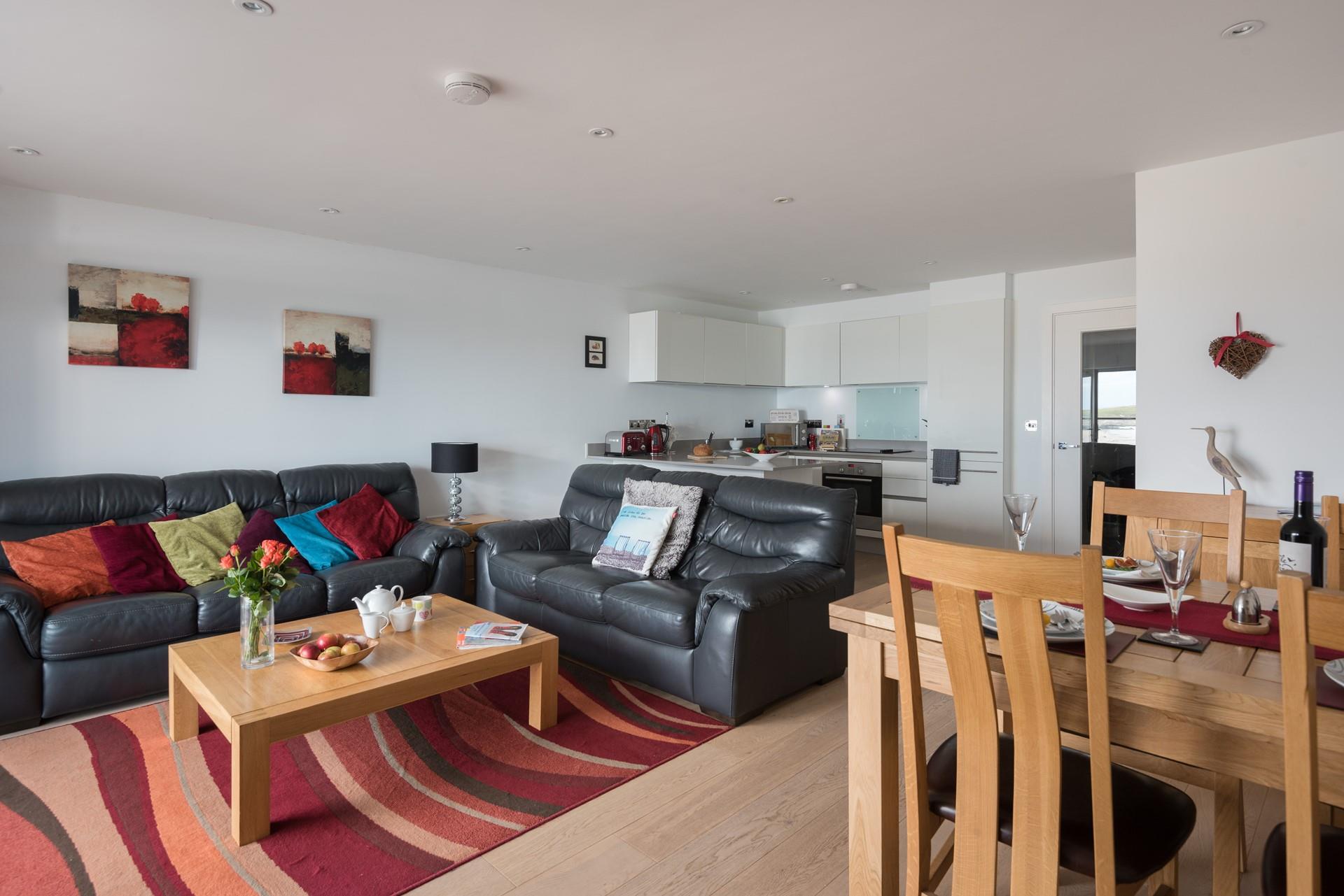The living area is a warm and cosy space, perfect for snuggling up after a day of exploring.