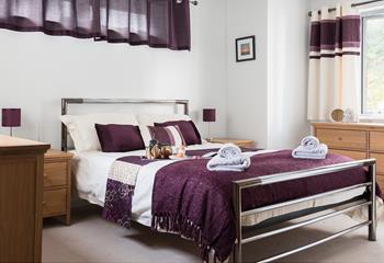 Bedroom 1 has a sumptuous king size bed and plenty of storage space for your belongings. 