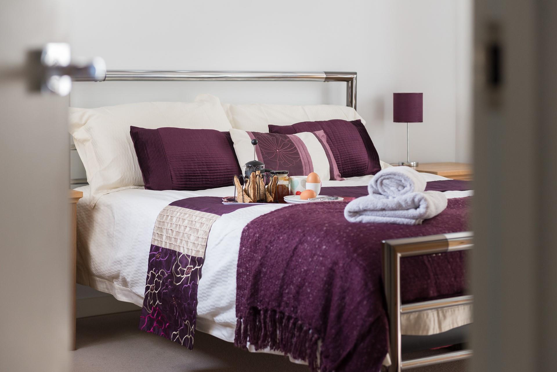 Both bedrooms have TVs and DAB clock radios.