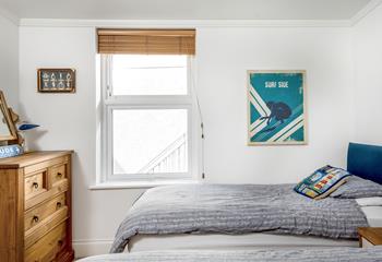 The twin bedroom is light, airy and continues the nautical theme.