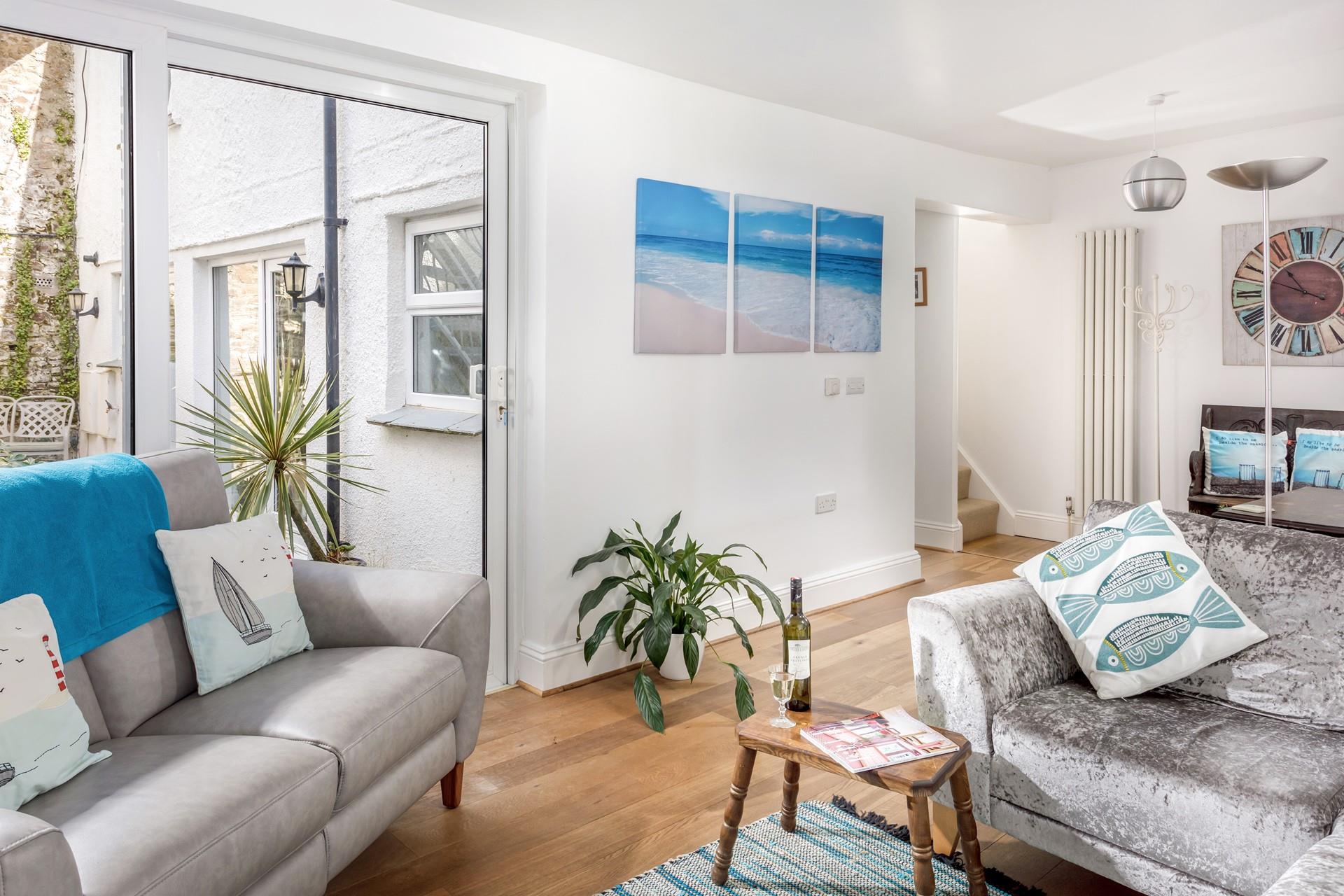 Open a bottle of wine and unwind in the evening in the modern sitting room.