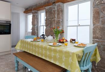 An exposed stone feature wall adds some Cornish character to the kitchen.