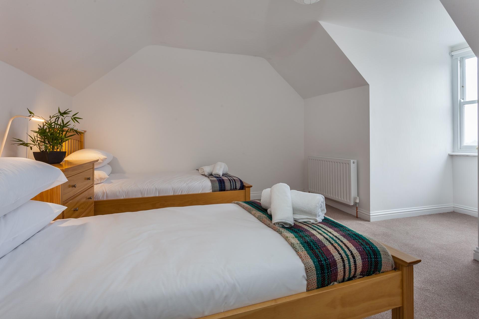 The spacious twin room is ideal for young adults or children.