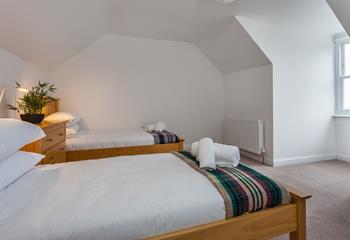 The spacious twin room is ideal for young adults or children.