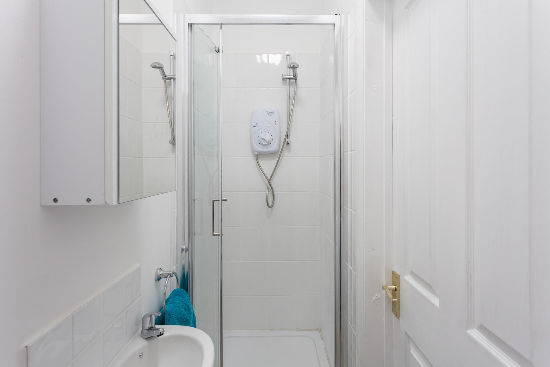 Wash off sandy toes in the shower after a day on the beach.