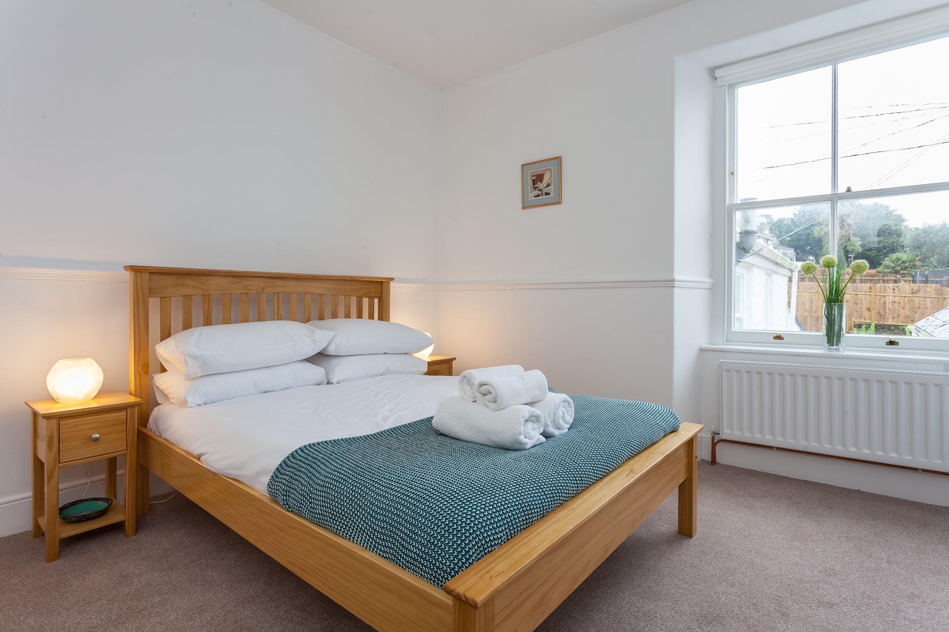 Fluffy towels and soft sheets await in bedroom 3.