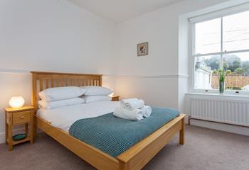 Fluffy towels and soft sheets await in bedroom 3.