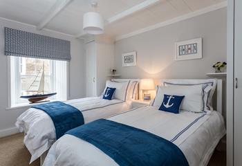 Enjoy the nautical theme in this twin room.