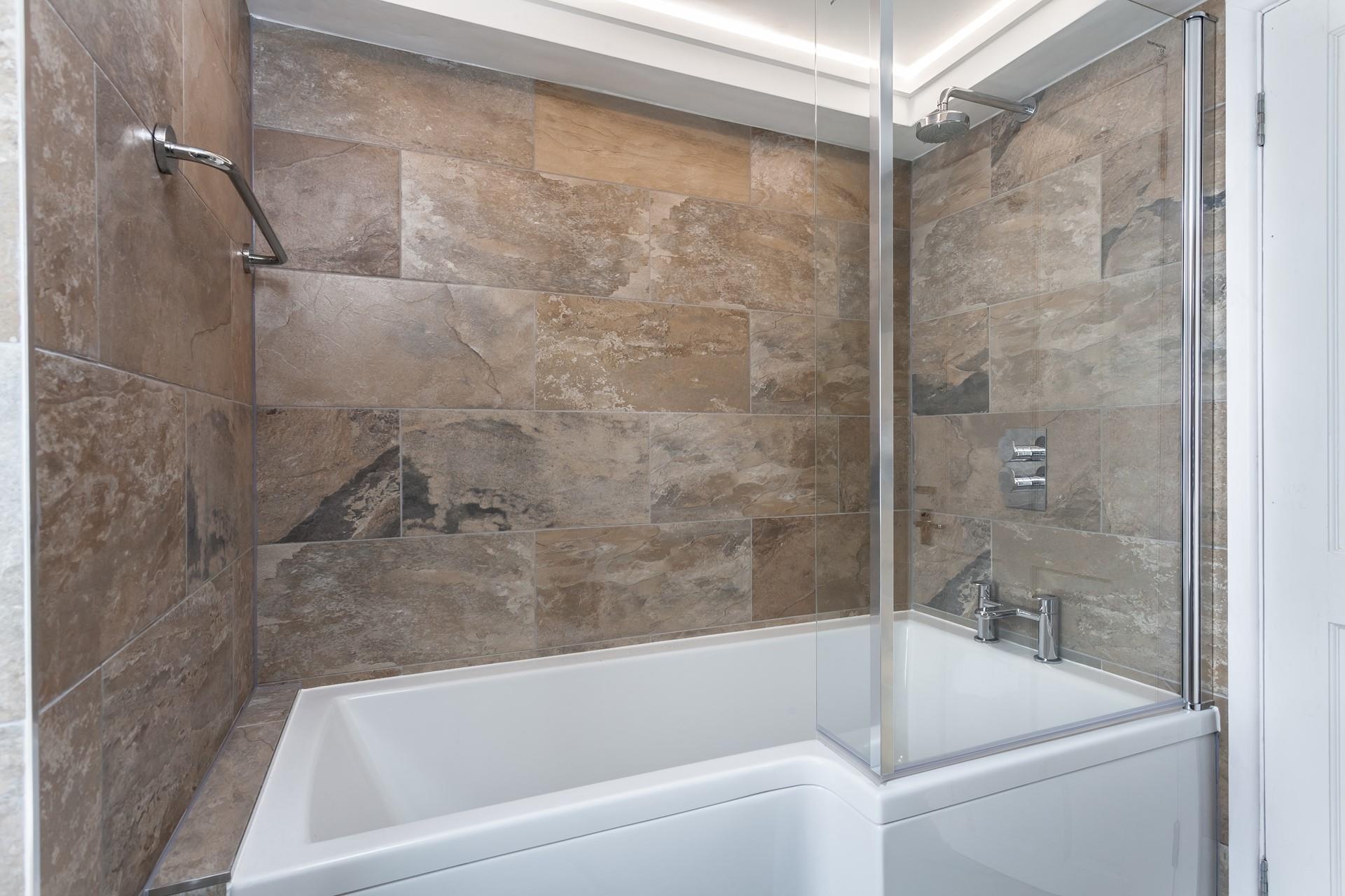 Relax in the large bath after a day at the beach.