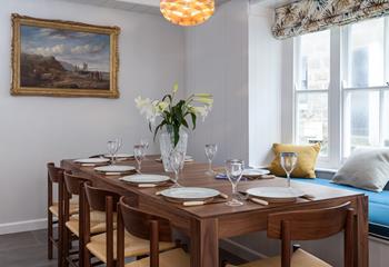 The large dining table offers the perfect place to dine with loved ones.