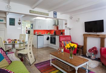 The quaint cottage is uniquely furnished with pops of colour throughout.