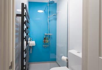 The shower room has a walk-in shower with a superb rainfall shower head, perfect for freshening up before a night out in St Ives.