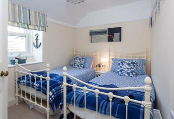 Bedroom 2 has twin beds, perfect for the kids to tuck into each night.