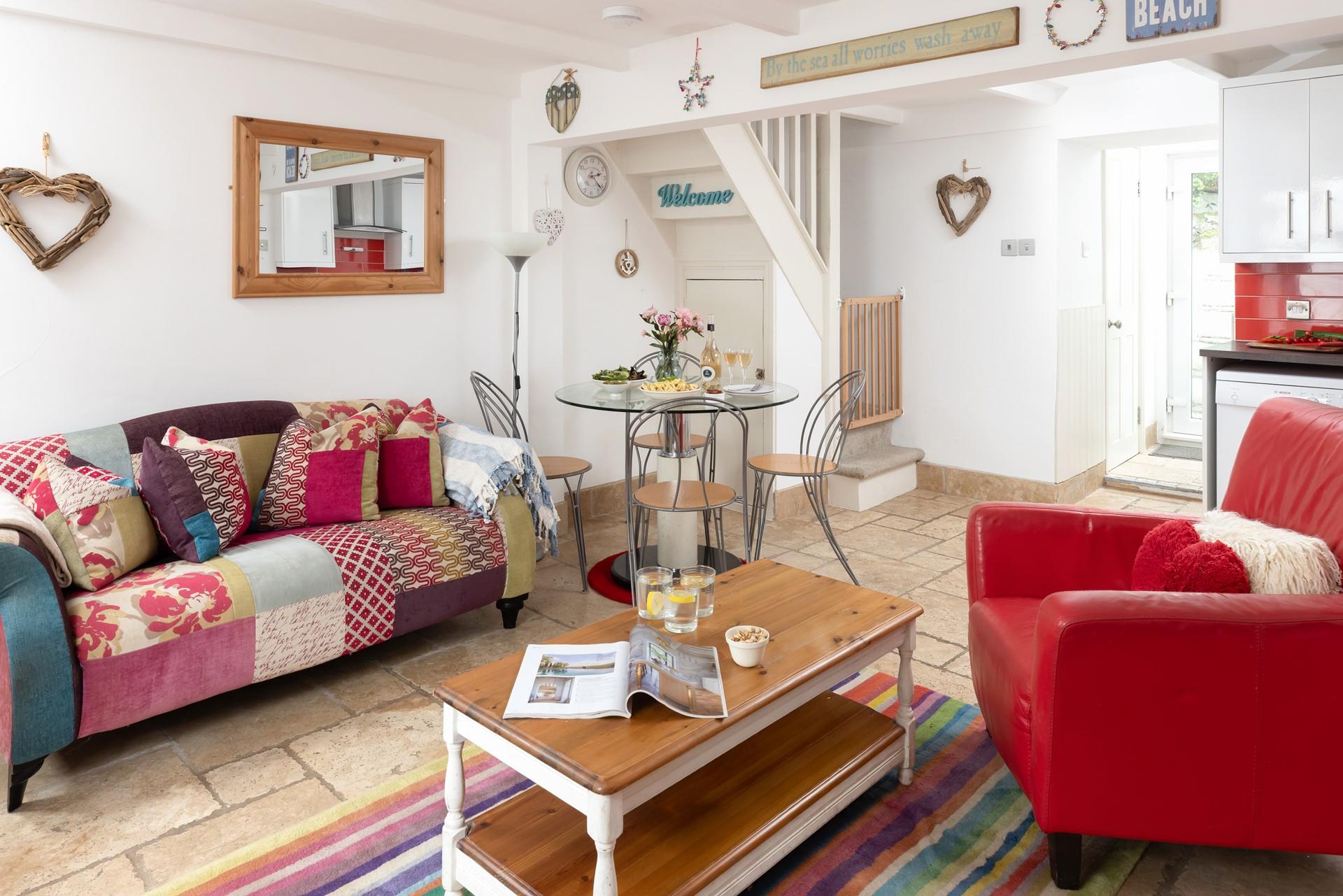 The quaint cottage is uniquely furnished with pops of colour throughout.