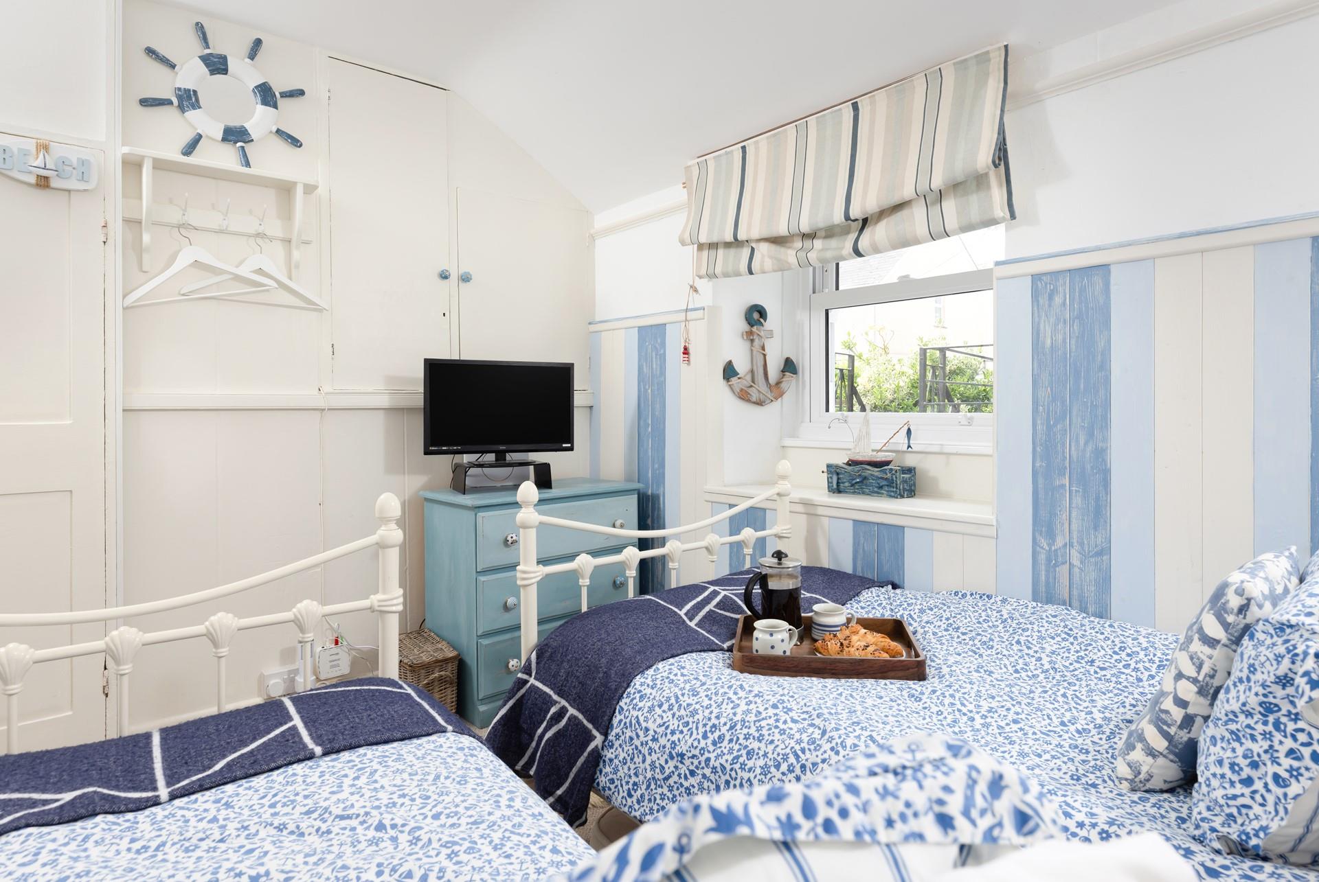 Twin beds look out onto the garden.
