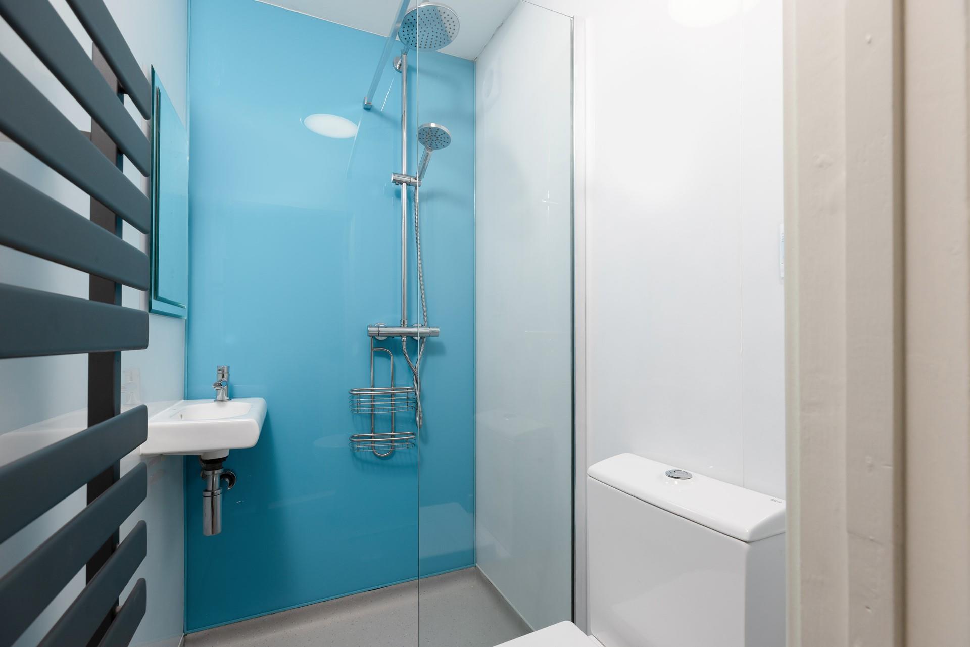 You'll find a rainfall shower and heated towel rail in the shower room.