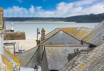 Bedroom 2 offers a glimpse of the sea across the quaint St Ives rooftops.