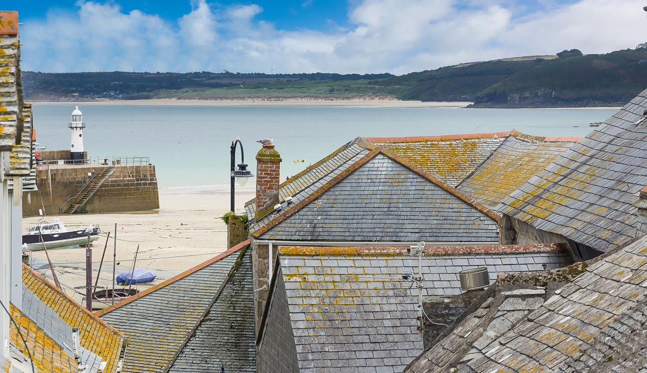 Bedroom 2 offers a glimpse of the sea across the quaint St Ives rooftops.