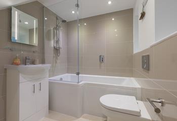 The family bathroom has a fantastic, spacious bath, perfect for indulging in bubbly soaks after a busy day!