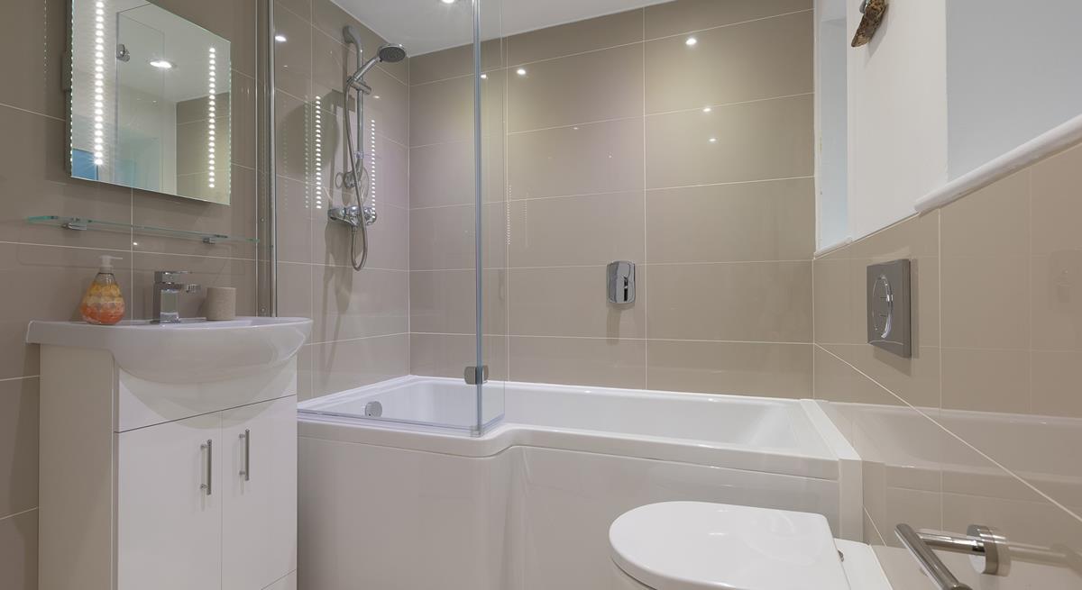 The family bathroom has a fantastic, spacious bath, perfect for indulging in bubbly soaks after a busy day!