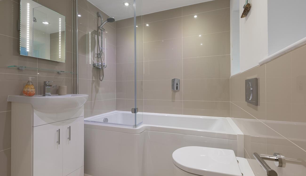 The family bathroom has a fantastic, spacious bath, perfect for indulging in bubbly soaks after a busy day!