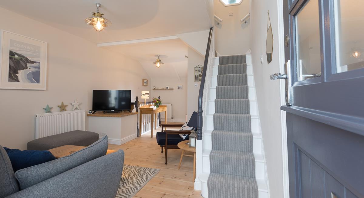 Modern and bright, with gorgeous nautical decor, the living space invites you to come in and relax.