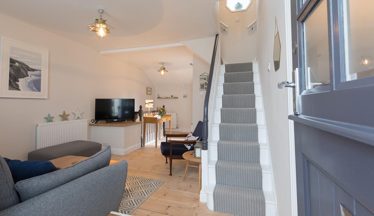 Modern and bright, with gorgeous nautical decor, the living space invites you to come in and relax.