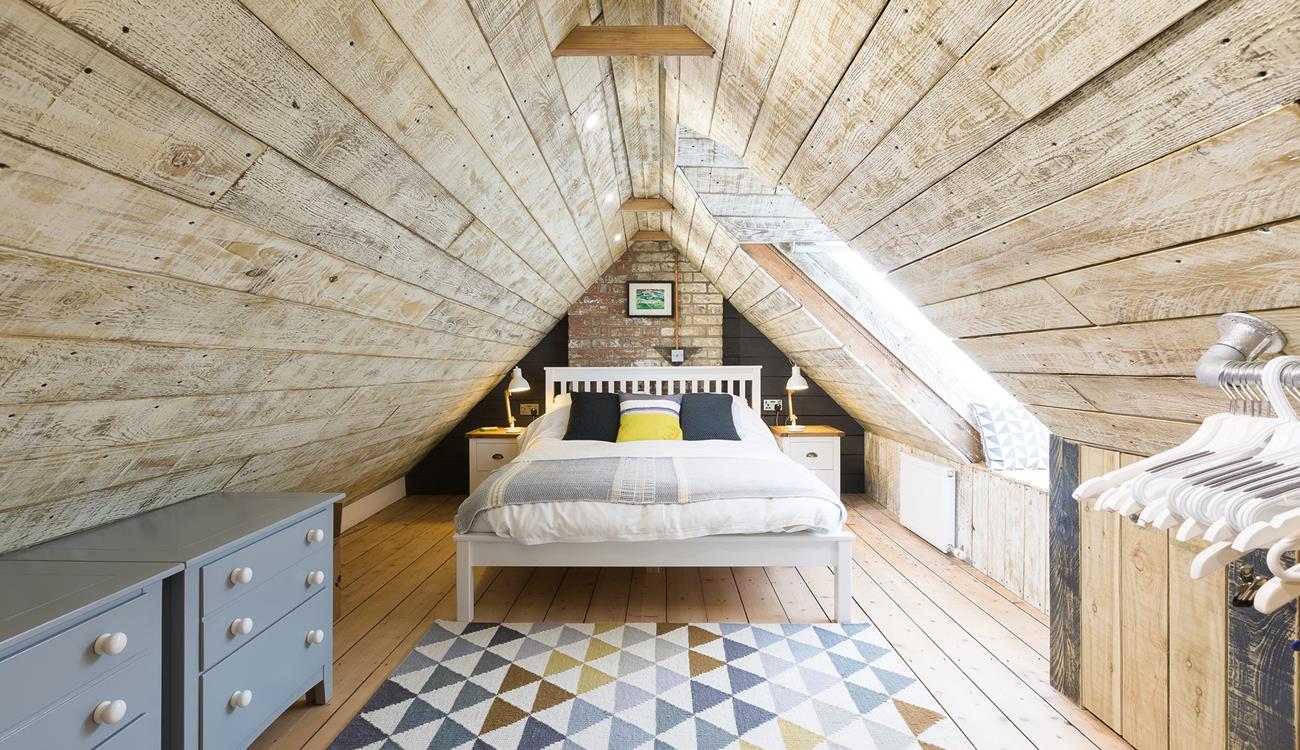 A unique and characterful bedroom, spend your mornings sipping your first hot drink of the day and admiring the view from the window seat.