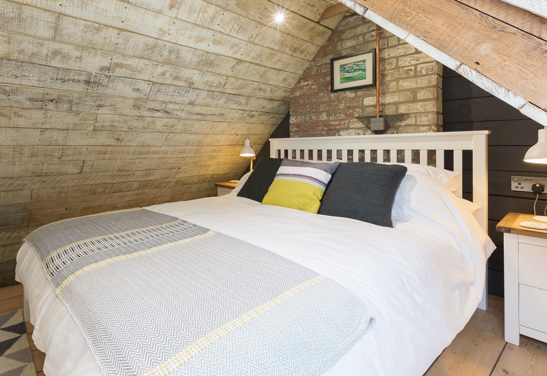 The comfortable king size bed promises a blissful night's sleep.