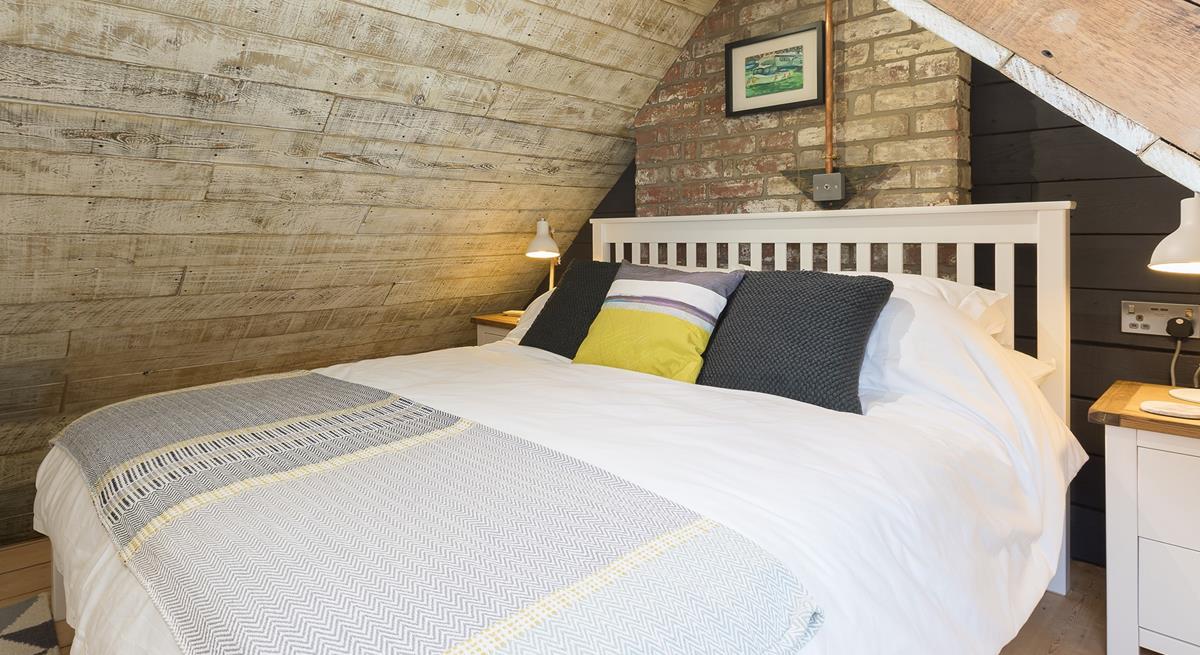 The comfortable king size bed promises a blissful night's sleep.