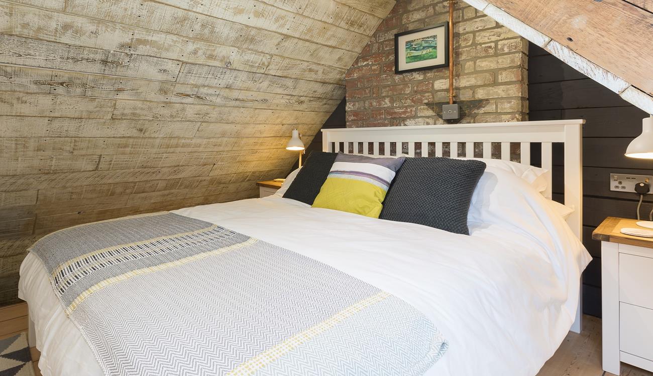 The comfortable king size bed promises a blissful night's sleep.